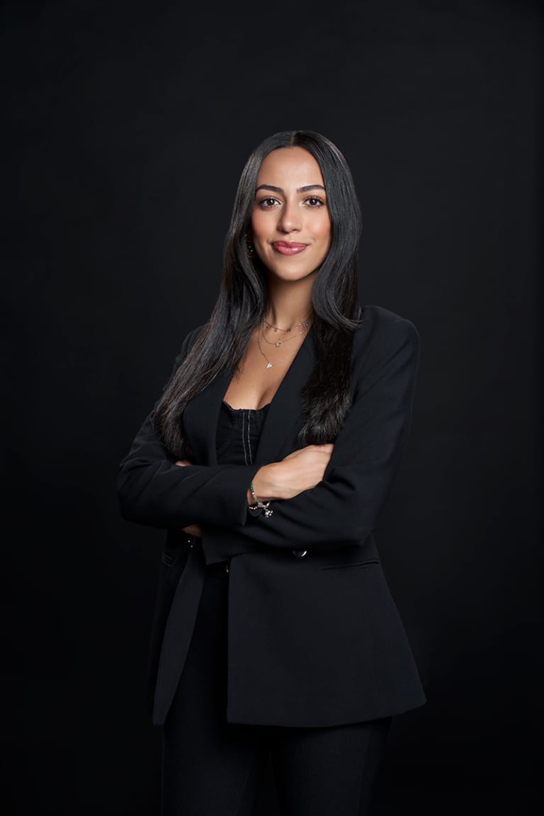 Individual business headshot of a woman in a black blazer