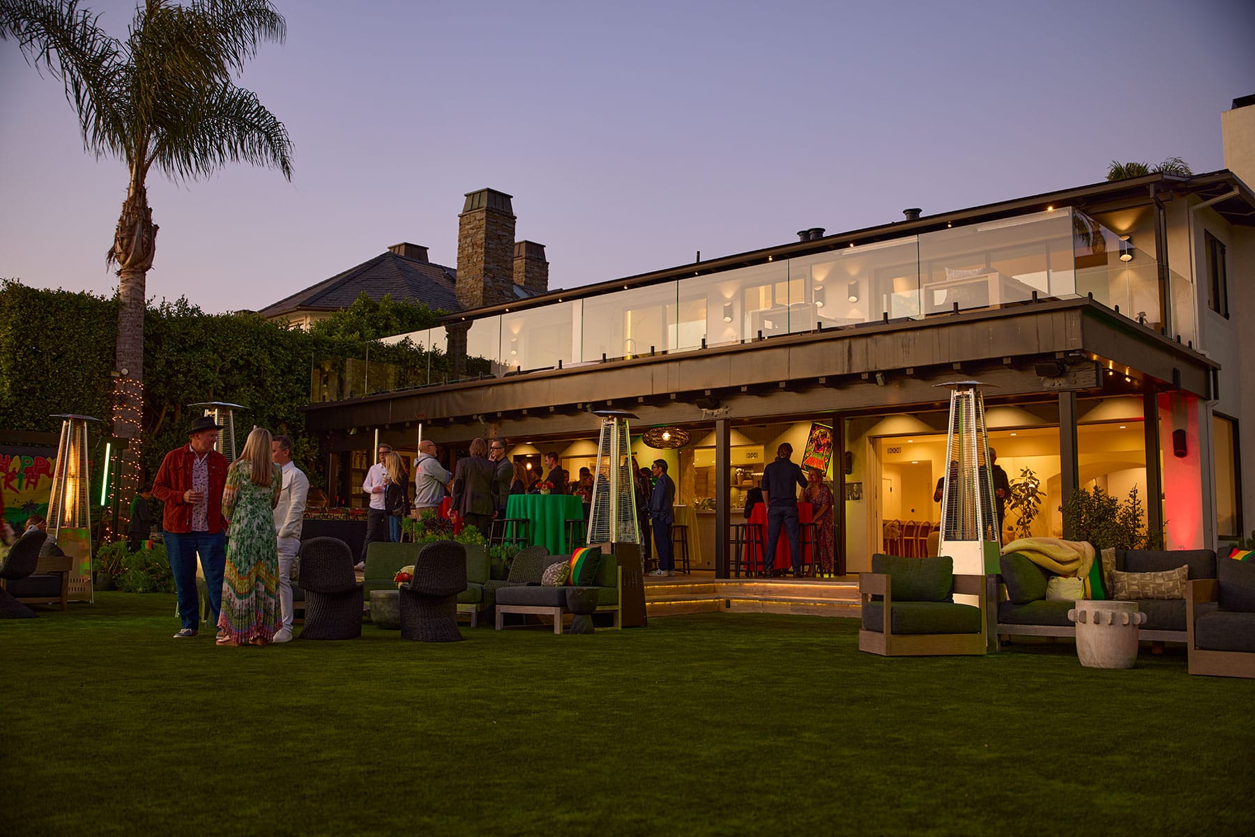 Los Angeles event photographer capturing an outdoor evening cocktail party at a modern home