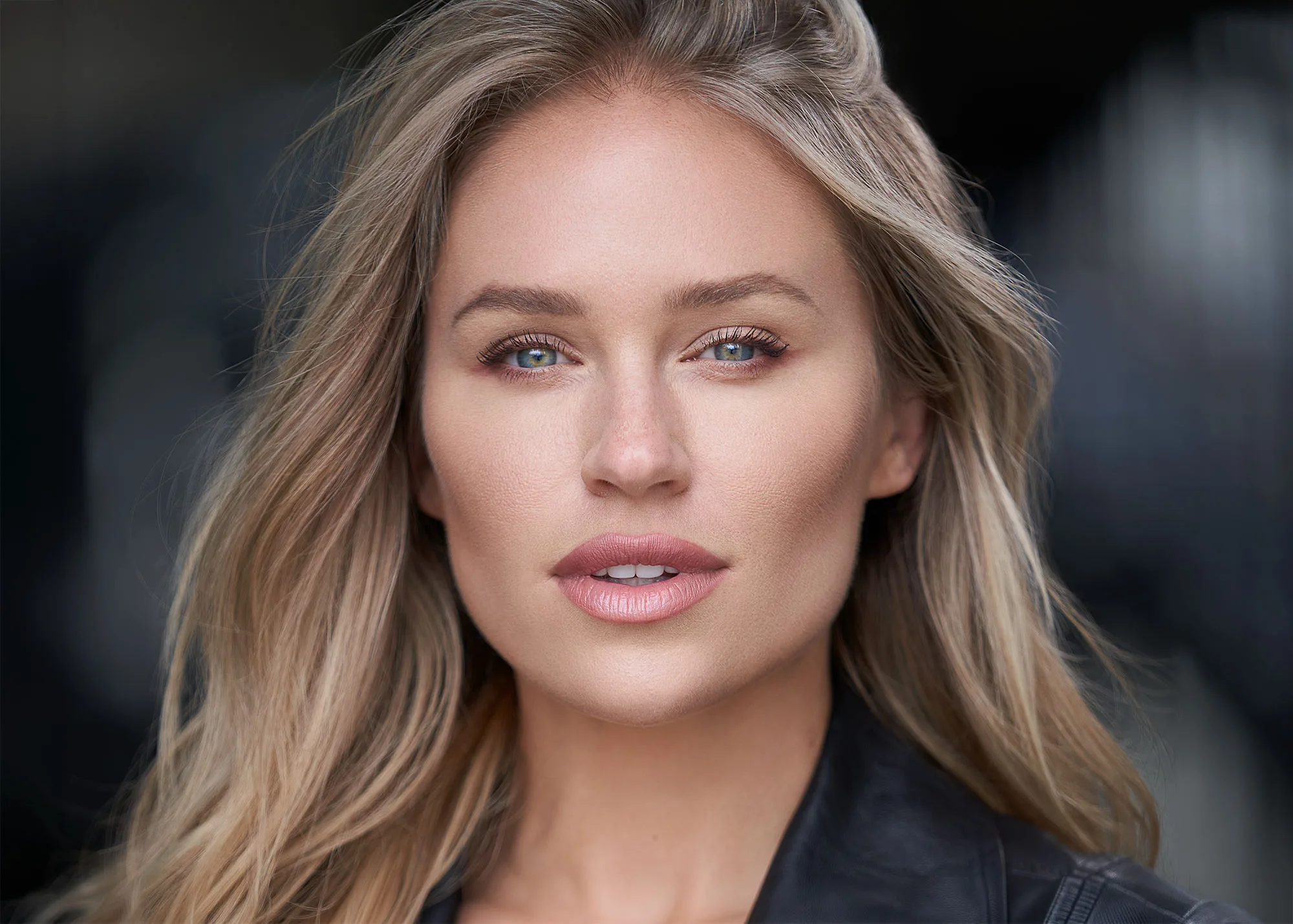 Kristen Louelle Gaffney in a neutral top on a warm gray studio backdrop - women's headshot by Headshots LA in Los Angeles.