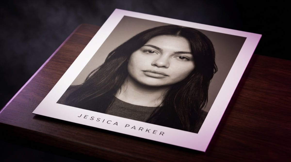 A printed 8x10 actor headshot with the actor’s name set below the photo